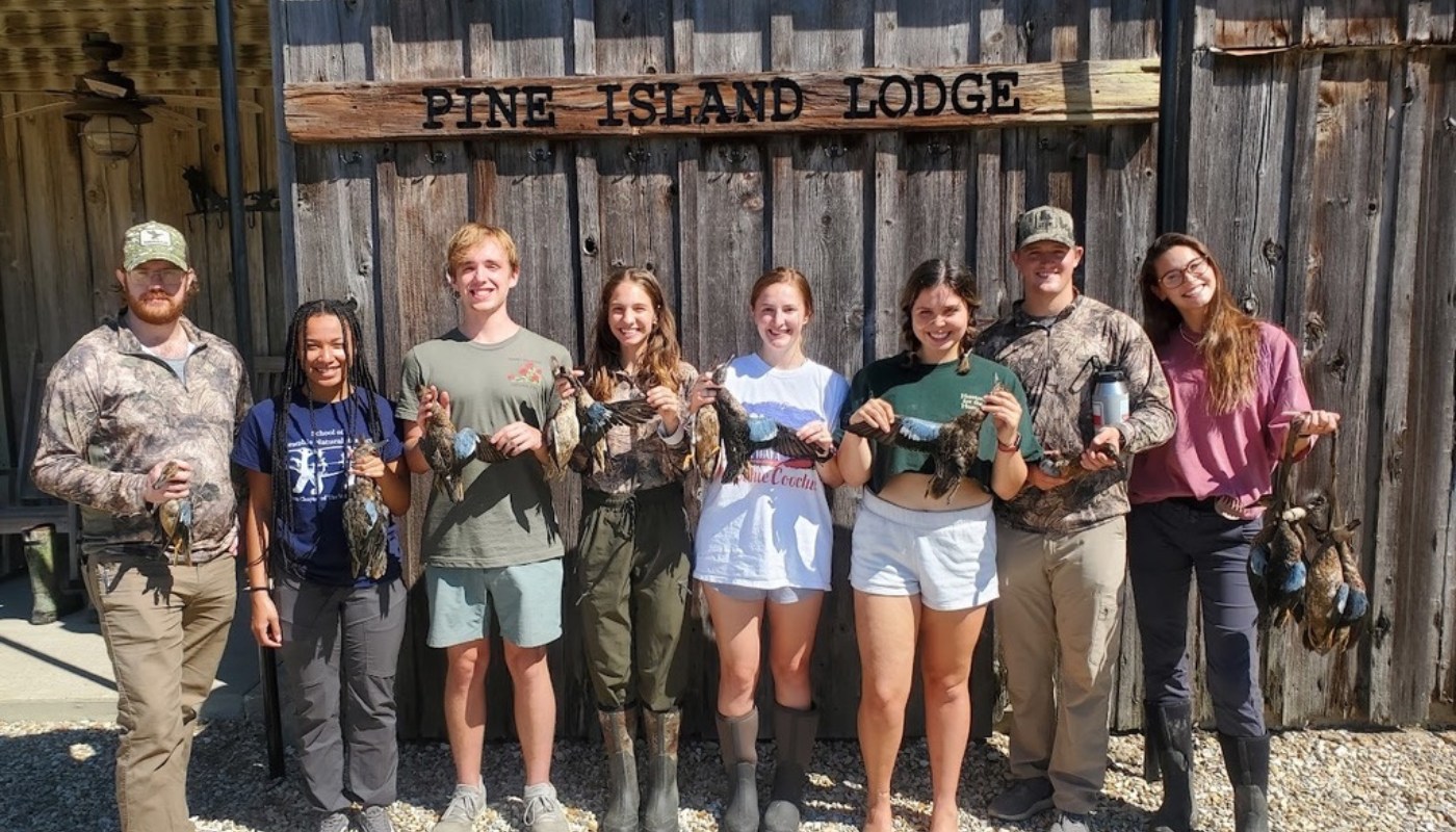 Students on RNR Hunting Trip Holding Birds