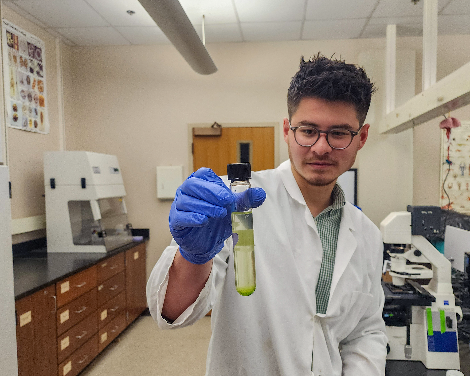 Jacob Chen holding sample.
