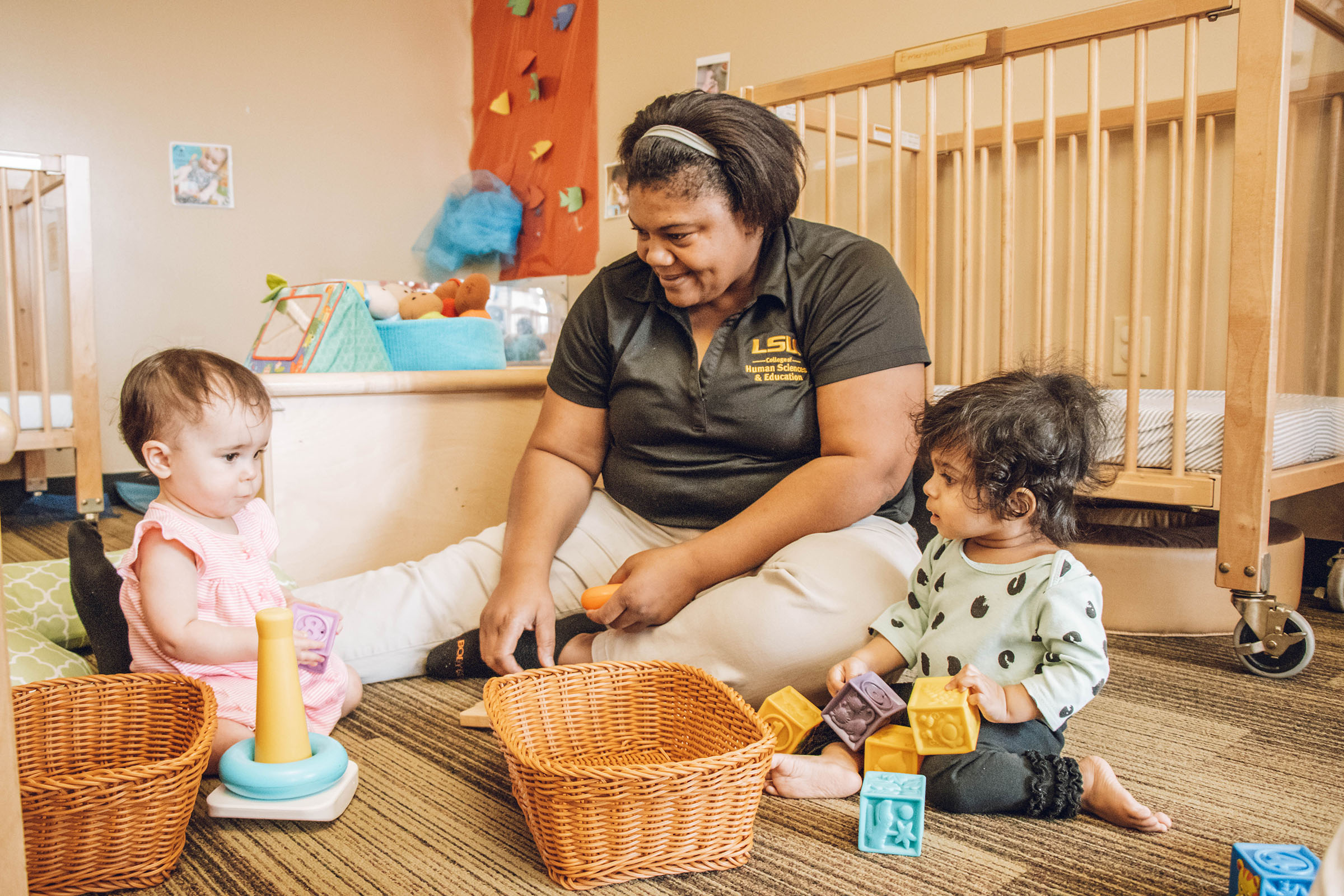 Teacher works with two children