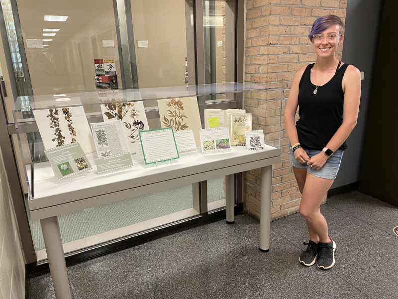 herbarium display case with its creator