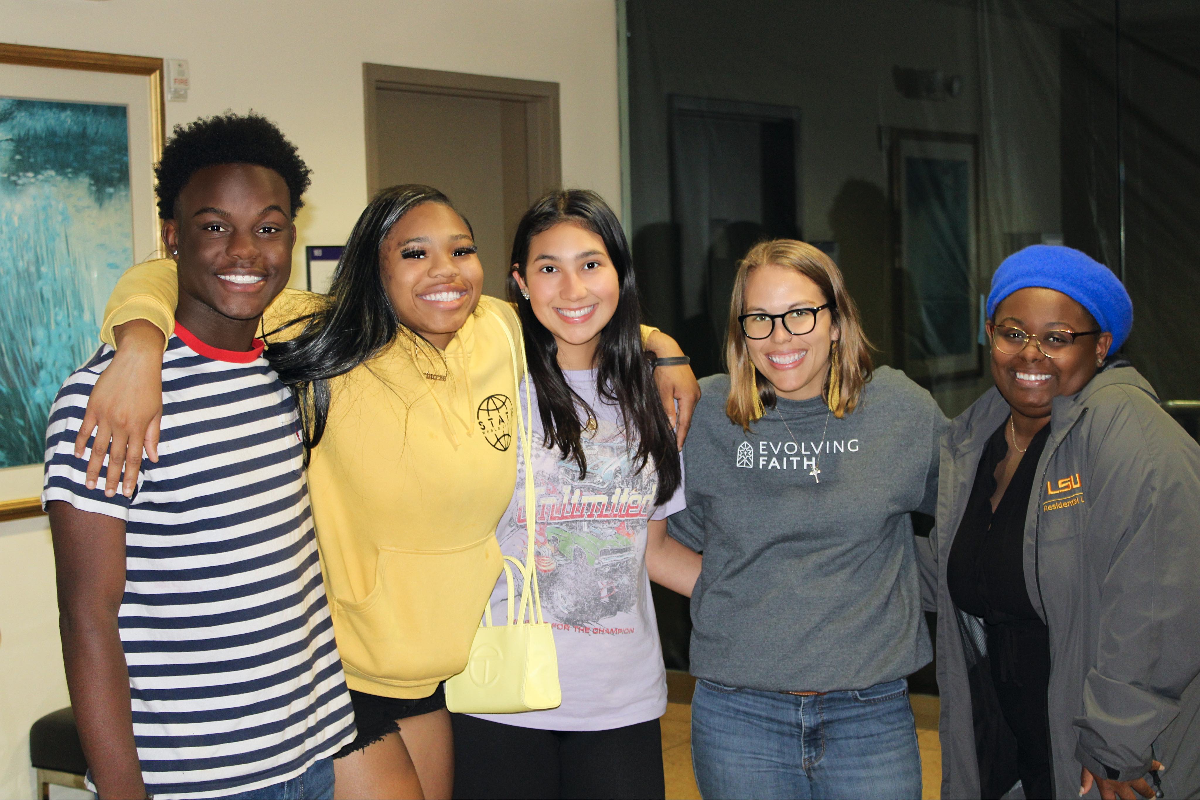 Students and a member of the Residential Life staff posing for a picture.