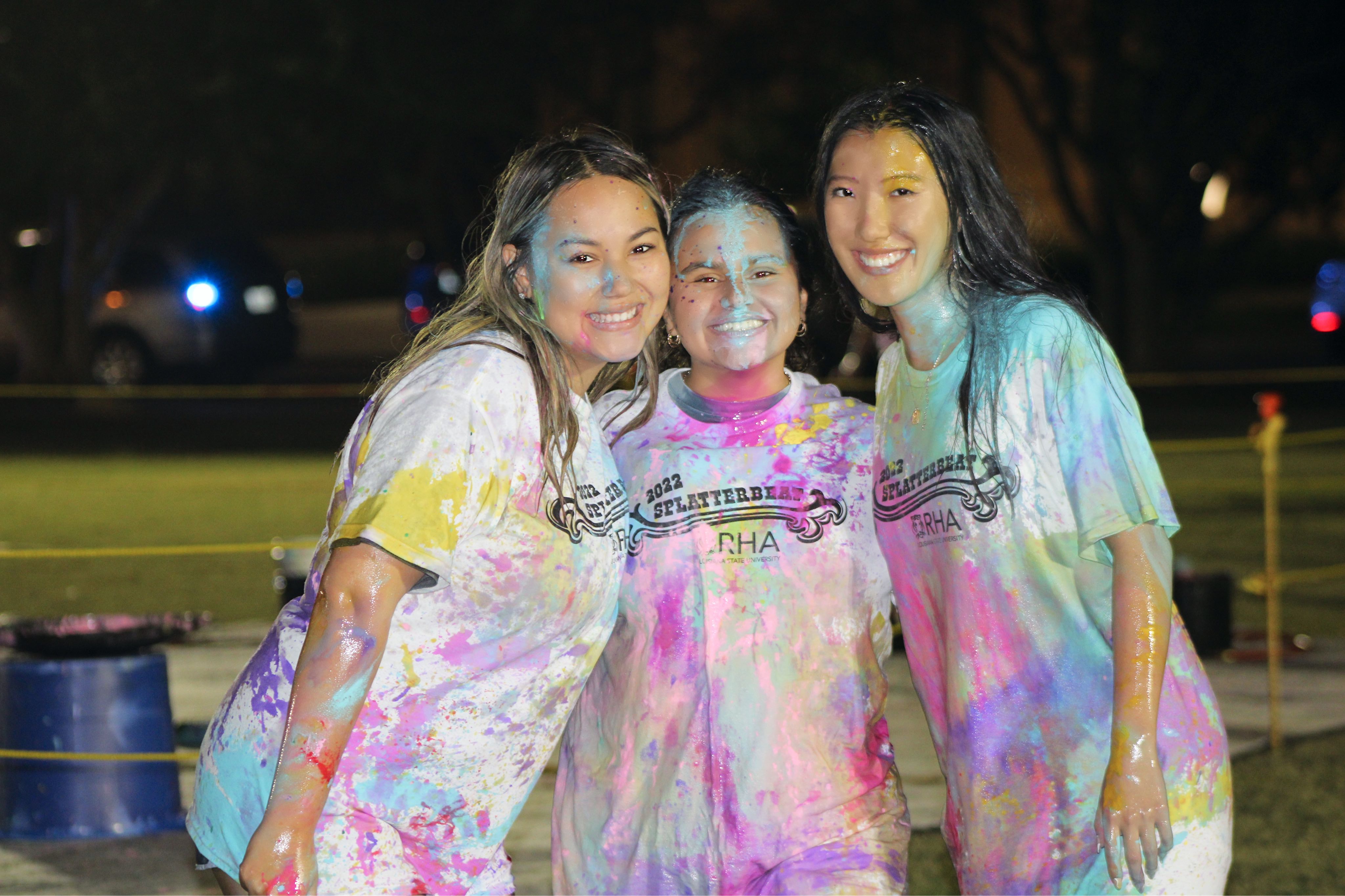 Paint-covered students posing for a picture at Splatterbeat.