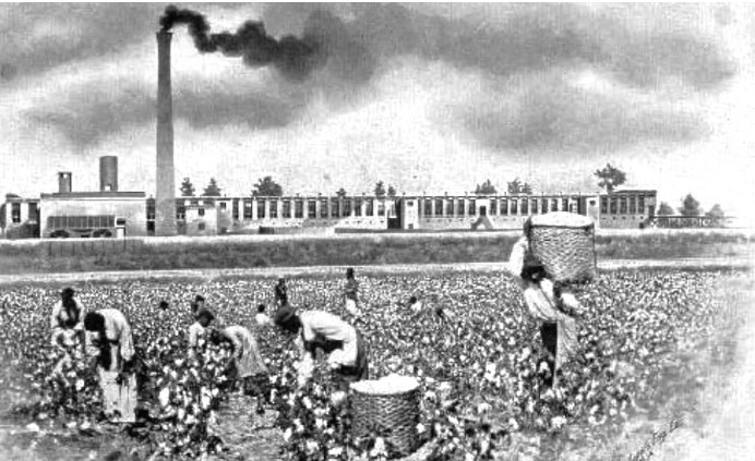 cotton field workers with factory in background